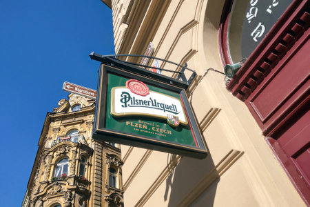 Prague, Czech Republic, November 15, 2022: Pilsner beer sign on a Prague street. Lots of beer bars and restaurants.のeditorial素材