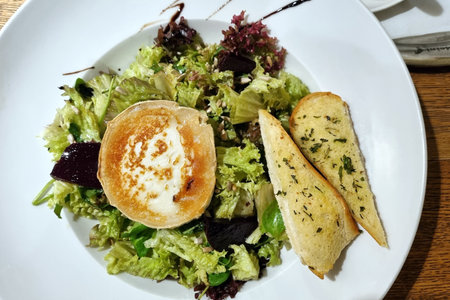 A tasty and healthy dish in a restaurant or caf . Vegetables and fishの写真素材