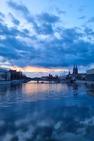Wroclaw, Poland, April 23, 2023: picturesque sunset on the bank of the Odra river in Wroclaw.