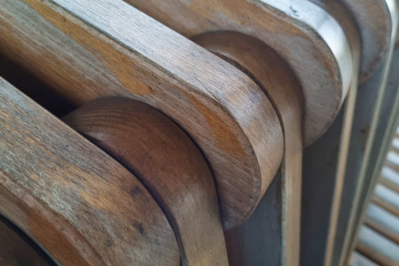 Close-up on a beautiful wooden bench in the parkの写真素材