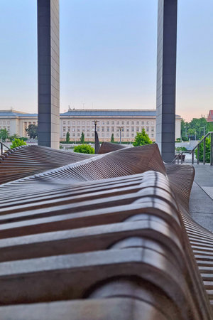 View of a beautiful wooden bench in the cityの写真素材