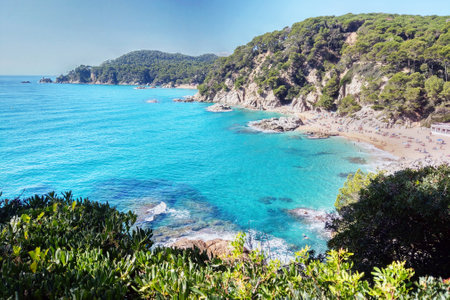 Vibrant coastal landscape showcasing turquoise waters and lush green hills, ideal for summer travel...