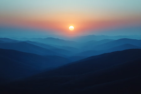 Serene sunrise over a series of blue-hued mountain ranges, creating a tranquil and calming landscape. the gradient sky transitions from warm oranges to cool blues, the peaceful beauty of nature. Generative AIの素材