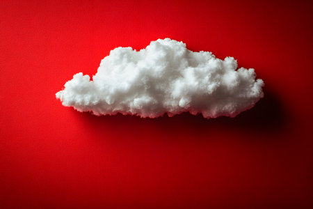 A single fluffy white cloud floats against a vibrant red backdrop, creating a striking visual contrast. ideal for creative design projects, abstract art, or concepts emphasizing imagination and contrast. Generative AIの素材