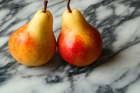 Two ripe pears with a yellow and red gradient stand side by side on a marble surface, their natural textures. the setting creates an aesthetic appeal suitable for kitchen decor and culinary-themed designs. Generative AIの素材