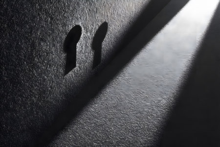 A minimalist composition the interplay of light and shadow through two keyholes on a textured wall. the stark contrast and simple geometry create a profound visual effect ideal for modern design aesthetics. Generative AIの素材