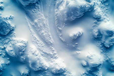 A stunning aerial view of abstract snow formations, resembling sand dunes, bathed in soft blue light. perfect for winter-themed projects, this captivating scene offers a sense of tranquility and natural beauty. Generative AIの素材