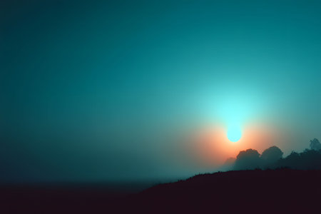 A serene sunrise paints the sky with a soft gradient of blue and orange hues. silhouetted trees and a gentle haze create a tranquil atmosphere, perfect for nature-inspired designs or print decor. Generative AIの素材