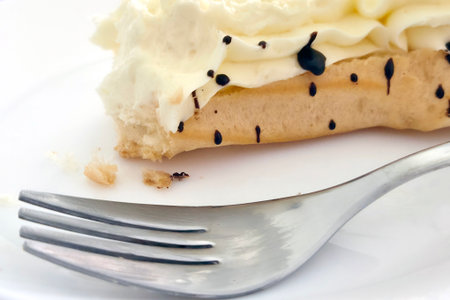 Delicious Cream Puff Pastry with Chocolate Drizzle on White Plate for Dessert Inspiration
