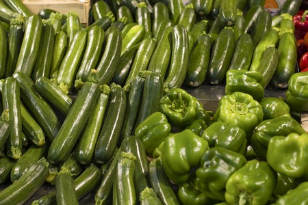 green zucchini and peppers at the supermarket for saleの写真素材