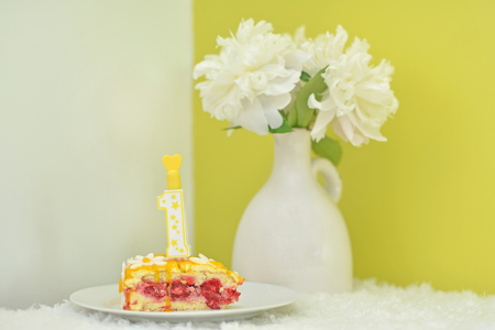 piece of cake with raspberry filling for girl's birthday 1 year oldの写真素材