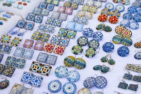 Glass square and round earrings with azulejo elements on the market in Porto