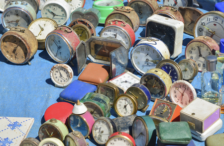 Many vintage clocks at a flea marketの写真素材
