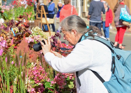 LE MANS, FRANCE - SEPTEMBER 30, 2017: Grandmother with cameraのeditorial素材