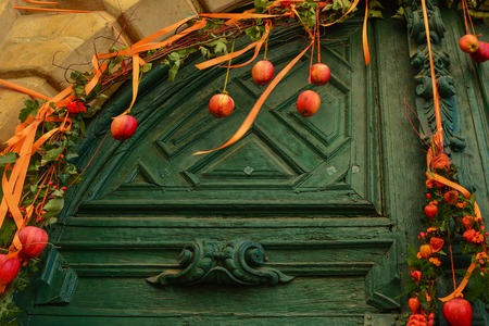 Decoration of apples on the green vintage doorの写真素材