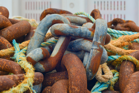 Old rusty naval chain in a portの写真素材
