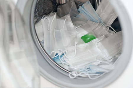 Washing disposable surgical masks with podsの写真素材