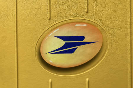 PARIS - APRIL 11, 2021: Embleme of La Poste postbox in Paris, France.