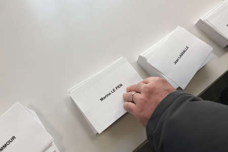PARIS, FRANCE - APRIL 10, 2022: Ballots with the names of candidates for elections in Franceのeditorial素材