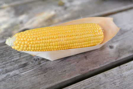 Corn in a wooden barbecue box
