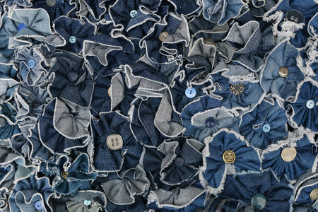 Denim blue jeans pieces with buttons Background textureの写真素材