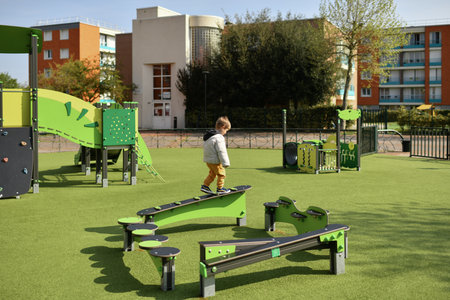 Boy playing on the playground in Europeの写真素材