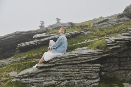 A woman hiking in the mountain at summerの写真素材