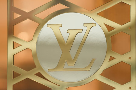 LILLE, FRANCE - FEBRUARY 21, 2024 : Golden logo sign of Louis Vuitton LV shopのeditorial素材