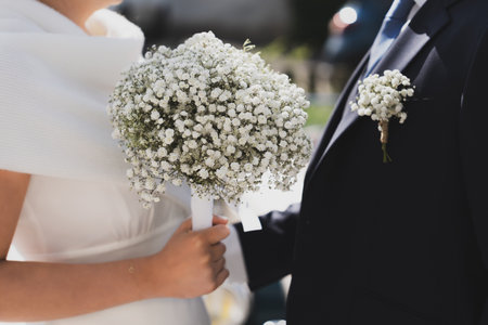 Bridal bouquet and a groom boutonniere of Gypsophilaの写真素材