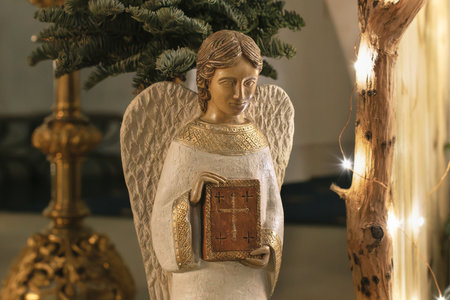 Angel with wings holds a bible Scene of the birth of Jesus Christの写真素材
