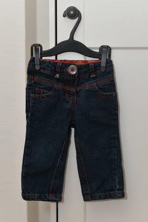 The pants of a child on a black hangerの写真素材