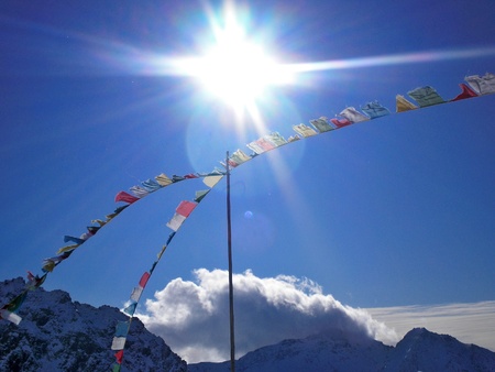tibetan flags in the wind in  gressoneyの写真素材
