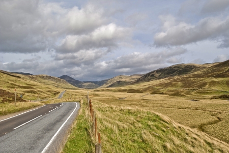 road across the Highlands in Scotland during autumnの写真素材