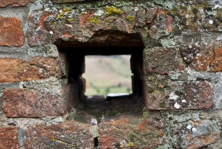 hole in the wall of castle of castell'arquatoの写真素材