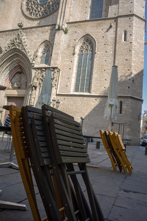 folded chairs in santa maria square in barcelonaの写真素材
