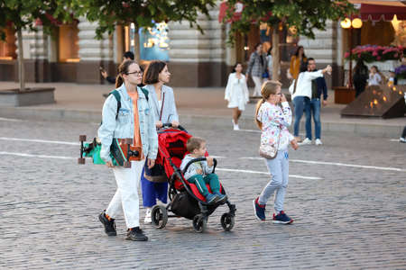 Children with mom walk along the street, Red Square, summer day. Russia Moscow June 2020.