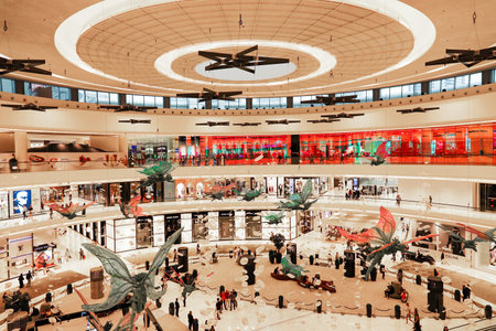 Dubai Mall, interior inside, shoppers walk around the store. Dubai, UAE March 2019のeditorial素材