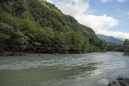 They begin their journey high in the mountains, merging with each other, and end their journey into the sea.の写真素材