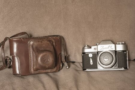 SLR camera using photographic film made in 1960 and a leather case.の写真素材