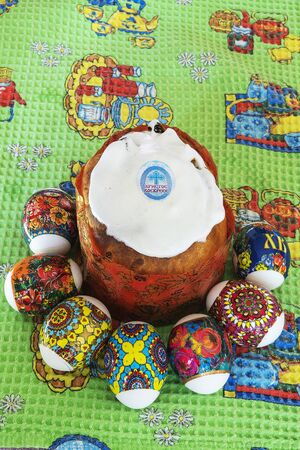 On the festive table are Easter eggs and a delicious cake, symbol of Easterの写真素材
