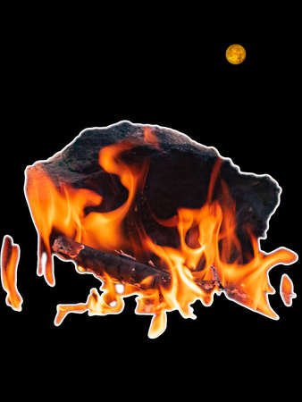 On a black background, a yellow moon and a fragment of a fire with a stone.の写真素材