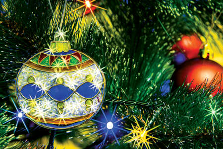 Christmas tree decorated for Christmas and New Year with Christmas tree decorations and LED garland close-up.の写真素材