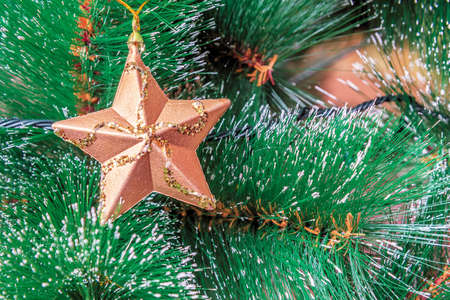 Christmas tree decorated for Christmas and New Year with Christmas tree decorations and LED garland close-up.の写真素材