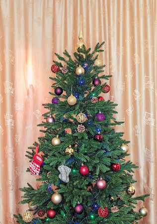 Close-up of a Christmas tree branch decorated with Christmas decorations for the holiday Christmas.の写真素材