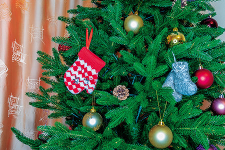 Close-up of a Christmas tree branch decorated with Christmas decorations for the holiday Christmas.の写真素材
