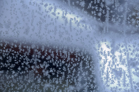 Winter patterns form after severe frosts on the glass.の写真素材