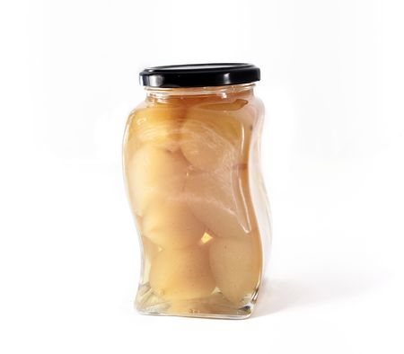 bottle of Pears in alcohol isolated on whiteの写真素材
