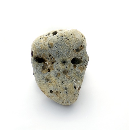 Grey head-like stone isolated on white background の写真素材