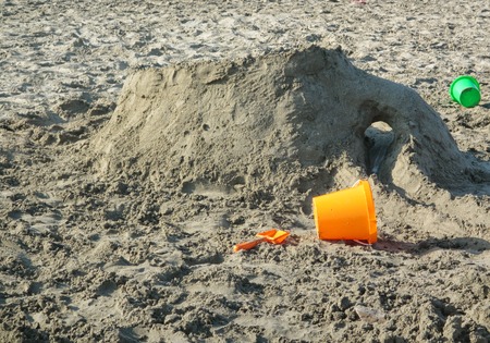 Sand on Beach with colored bucketsの写真素材