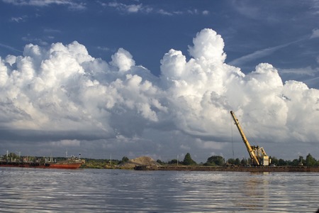 Sand charging on Volga, Russia with crane and boatの写真素材